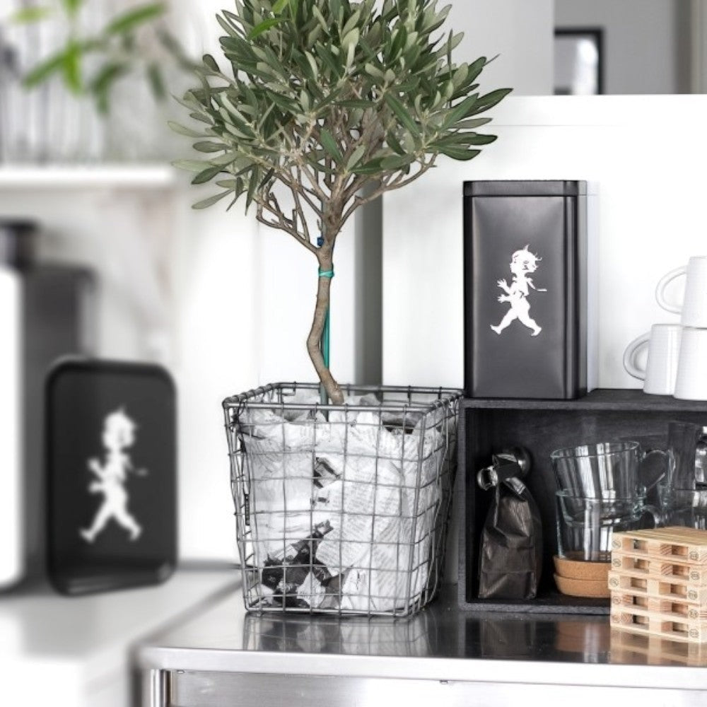 Solstickan black tin canister with boy graphic, ideal for coffee storage.