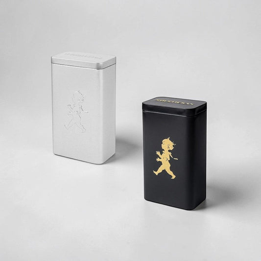Solstickan black and silver metal tins with classic boy graphic, ideal for coffee storage.