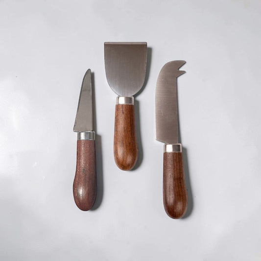 aelgmark Astrid cheese knives set with stainless steel blades and chocolate brown wood handles. Includes spreader, fork, and curved knife.