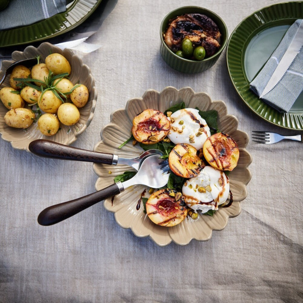 aelgmark Astrid salad servers with stainless steel and chocolate brown wood handles, perfect for serving salads.