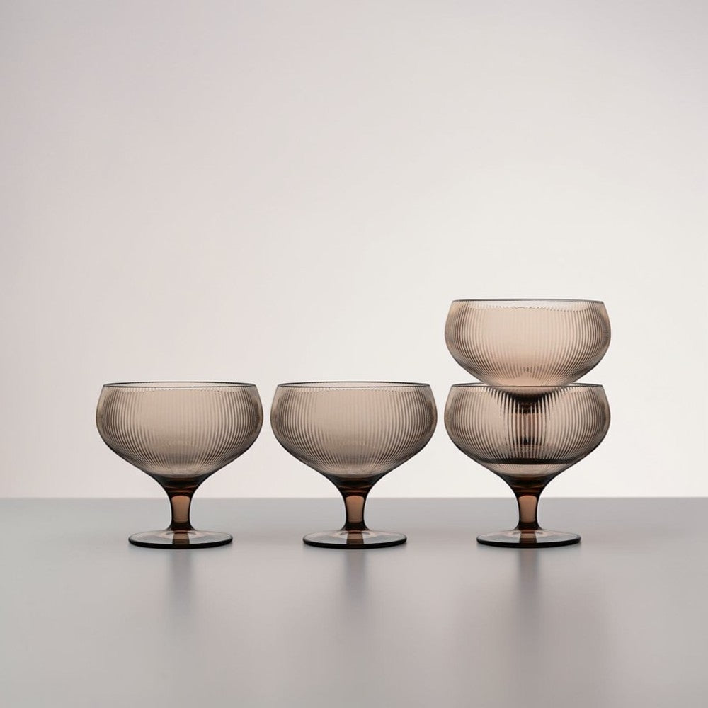 aelgmark Billi set of 4 wide-rimmed coupe glasses with ribbed texture and short stems in a taupe hue, perfect for desserts or drinks.