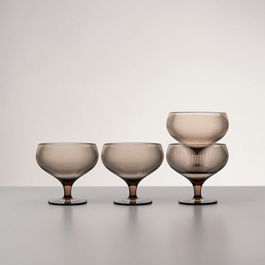 aelgmark Billi set of 4 wide-rimmed coupe glasses with ribbed texture and short stems in a taupe hue, perfect for desserts or drinks.