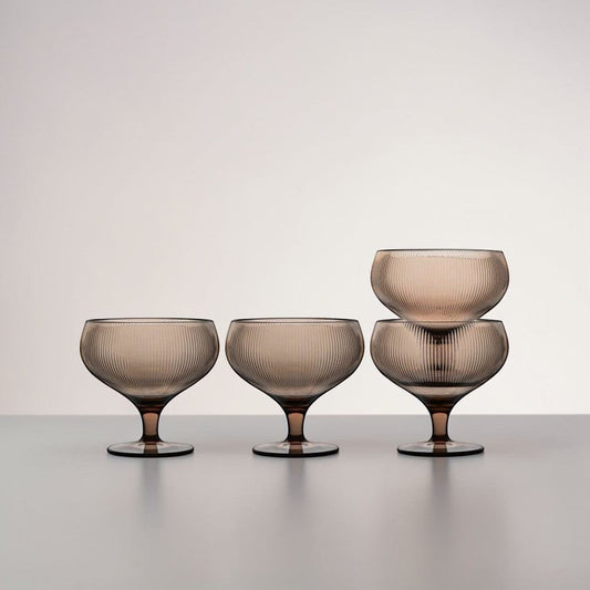 aelgmark Billi set of 4 wide-rimmed coupe glasses with ribbed texture and short stems in a taupe hue, perfect for desserts or drinks.