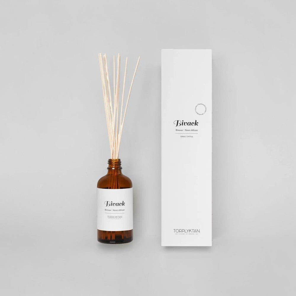 aelgmark Bivack room diffuser with cinnamon and blackberry scent in amber glass bottle with reeds.