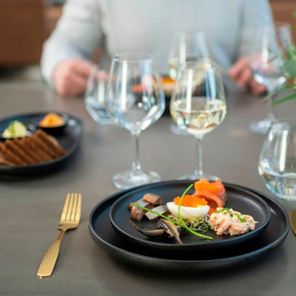 aelgmark black matte ceramic 21cm round plate with appetizer of salmon, egg, and herring. Perfect for starters or desserts.