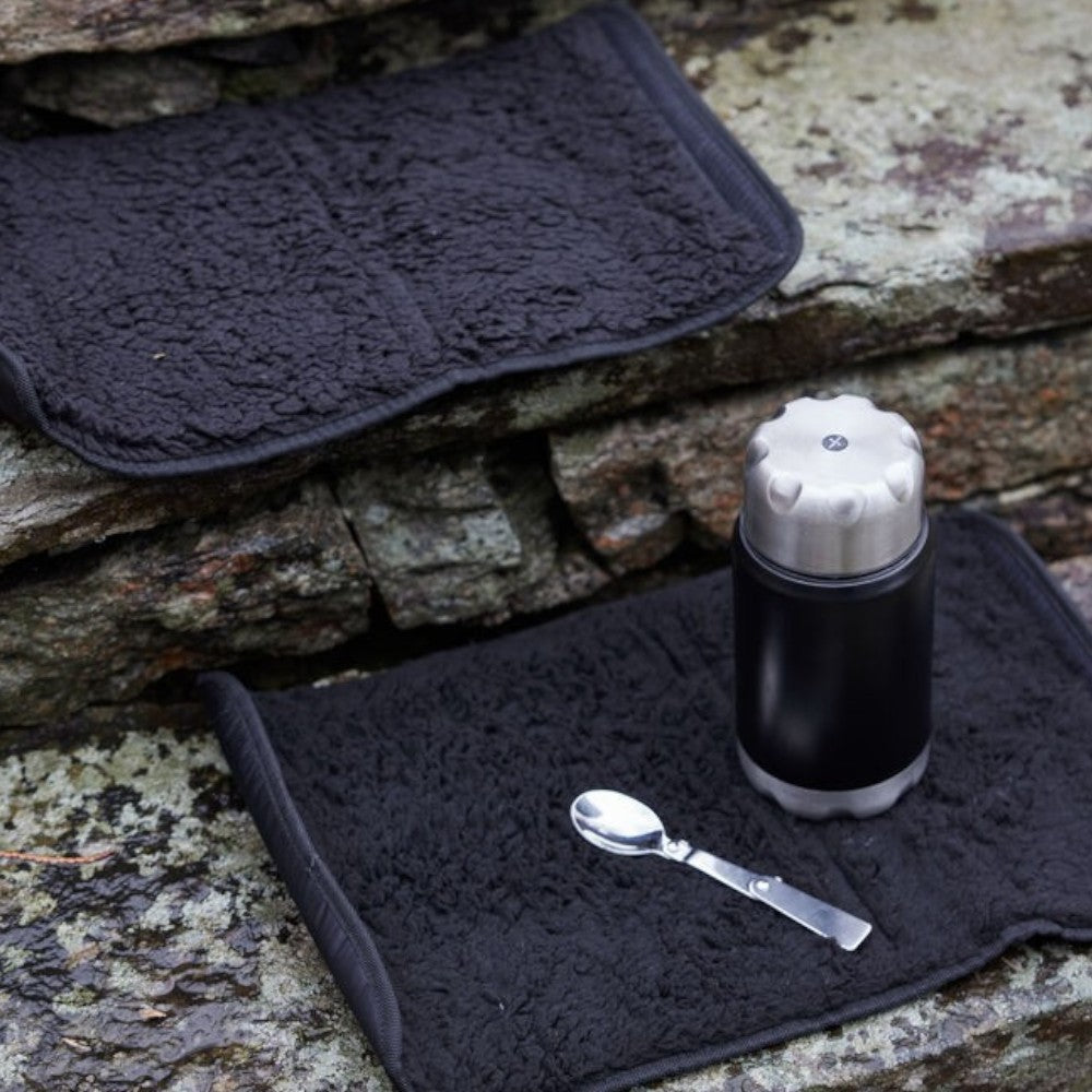 aelgmark black faux shearling outdoor seat cushion with waterproof backing and hook-and-loop fastener for easy rolling.