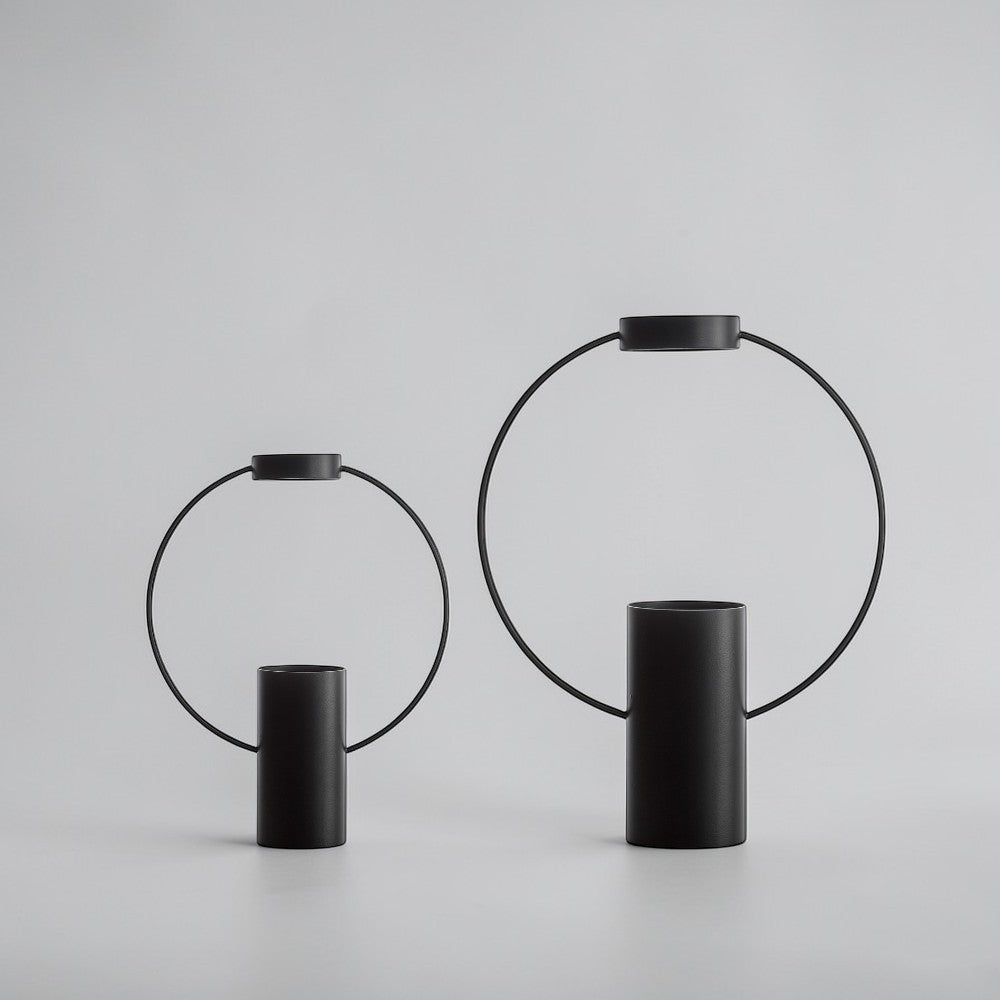 aelgmark black metal "moon" vase with a circular handle, modern geometric design, available in two sizes.