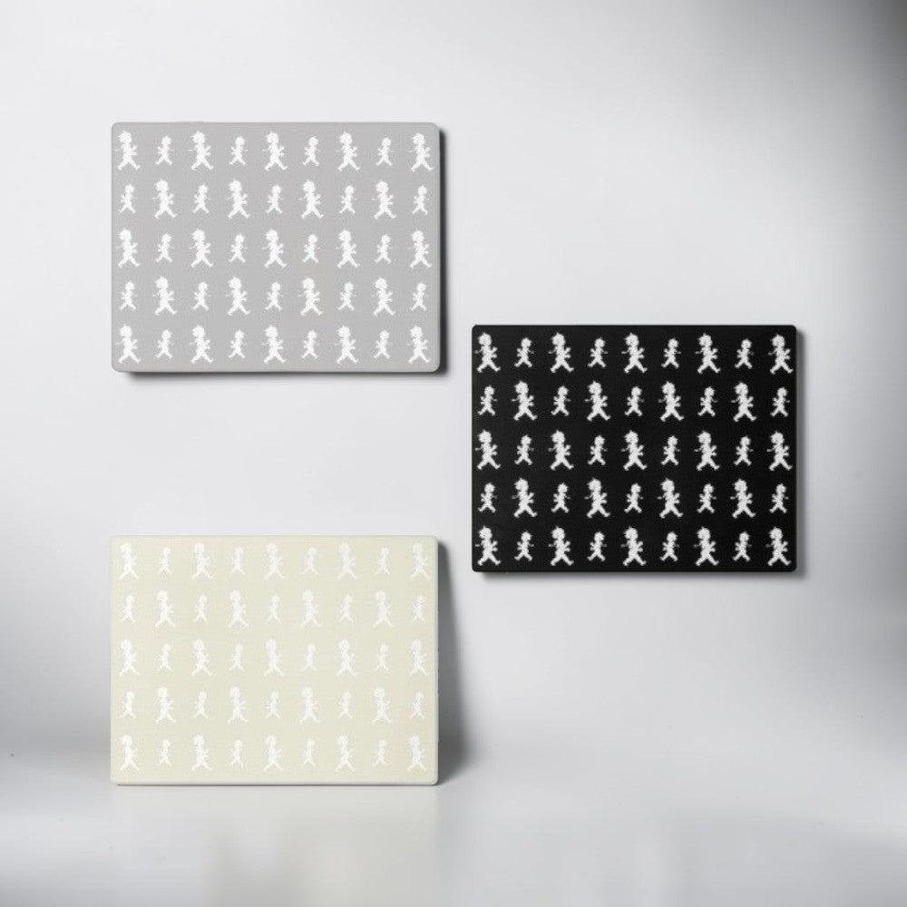 aelgmark placemats feature a repeating pattern of a boy in white on grey, black, and beige backgrounds.