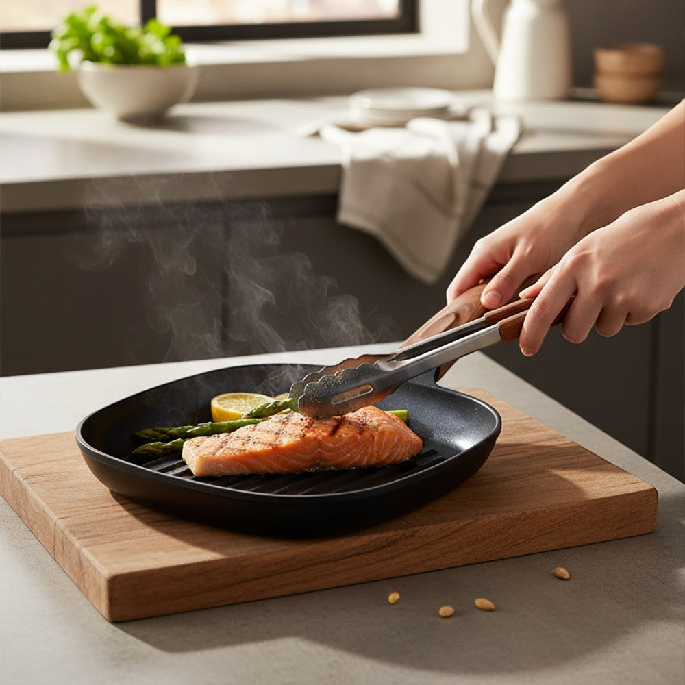 aelgmark square cast aluminum grill pan with ceramic coating, cooking salmon and asparagus.