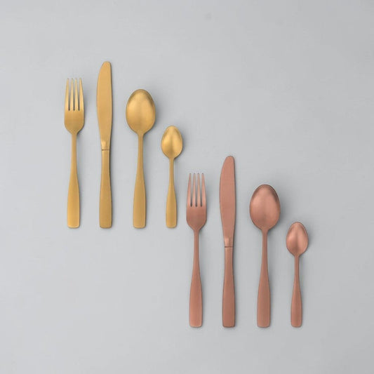 Aelgmark champagne gold stainless steel cutlery set, including fork, knife, spoon, and teaspoon. PVD coating.