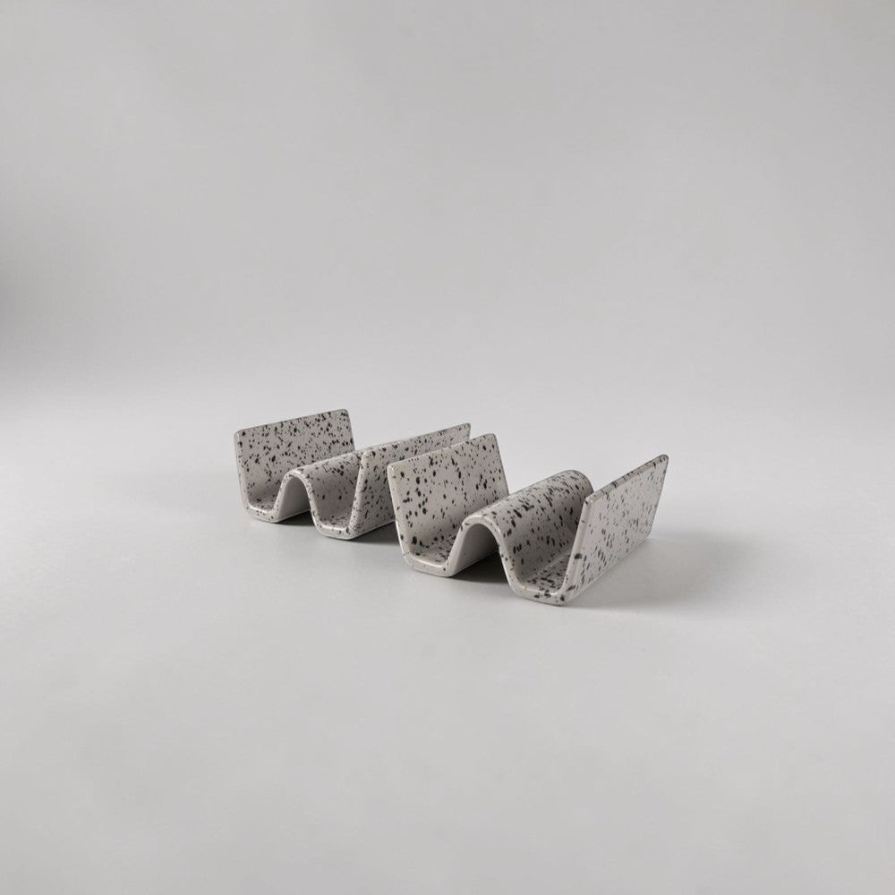 aelgmark Ditte set of 2 grey speckled ceramic taco holders, handmade with a unique splatter pattern.