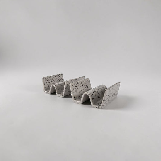 aelgmark Ditte set of 2 grey speckled ceramic taco holders, handmade with a unique splatter pattern.