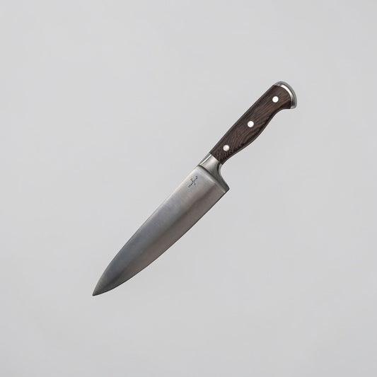 aelgmark Erik stainless steel chef's knife with dark wood handle and wave grip design.