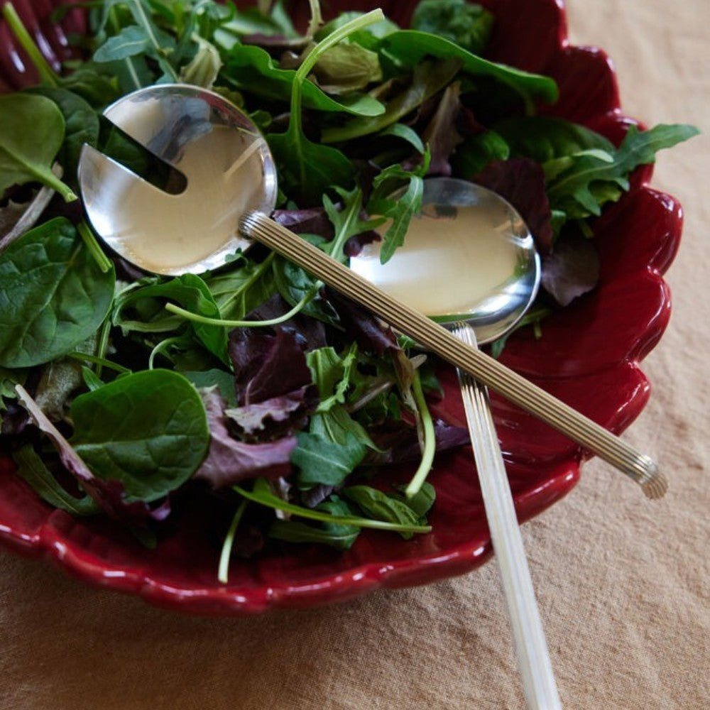 aelgmark Estelle stainless steel salad servers with ribbed handles and a notched serving spoon.