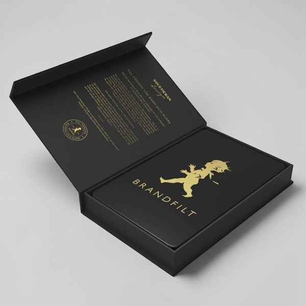 aelgmark fire blanket 120x120cm, made of fiberglass, in a black presentation box with gold embossed child graphic and text.