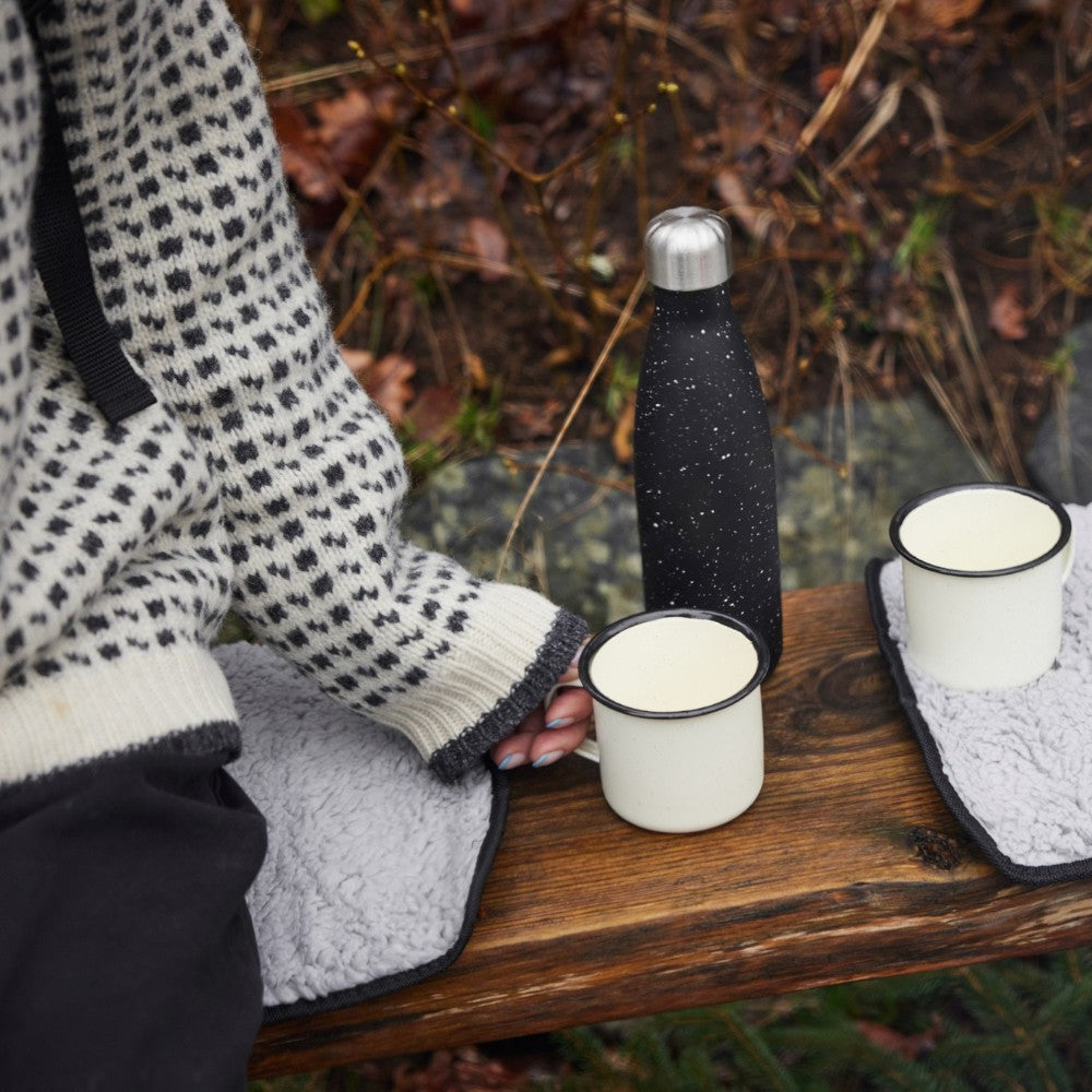 aelgmark grey faux sheepskin outdoor seat pad with waterproof backing and hook-and-loop fastener for easy rolling.