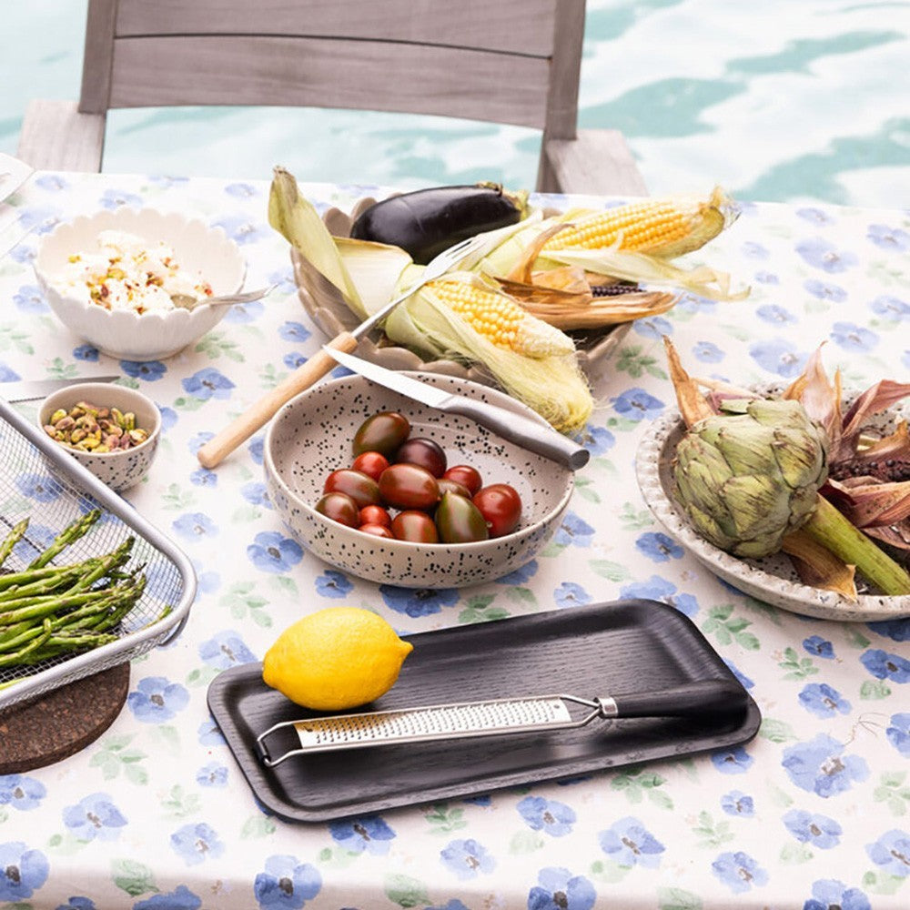 aelgmark Hanna matte black wood serving tray with a lemon and grater on a floral tablecloth