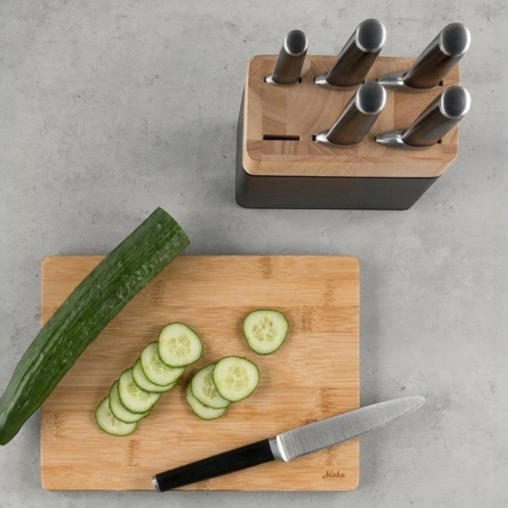 aelgmark knife block with bamboo and black base, holding six knives. Includes a bamboo cutting board with sliced cucumber and a knife.