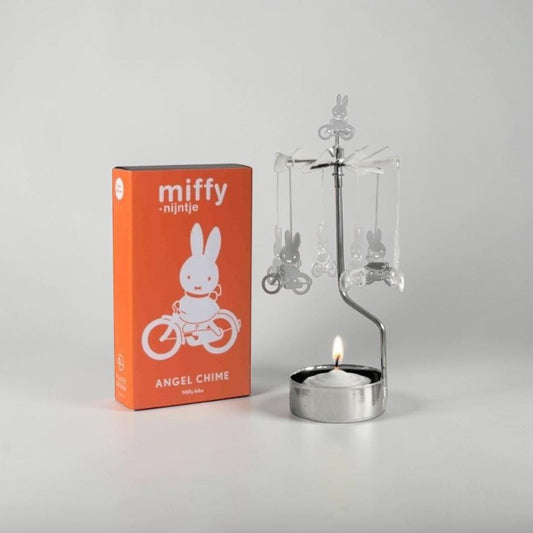 aelgmark Miffy bunny spinning candle holder with a lit tea light and Miffy figures on bicycles.