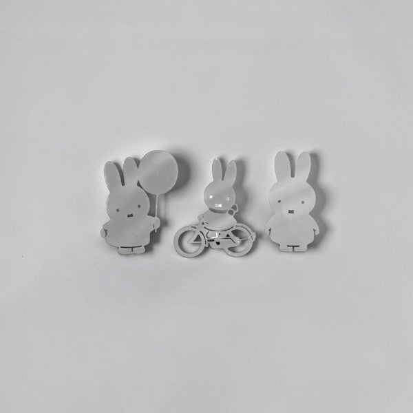 aelgmark Miffy silver metal magnets set: one holding a balloon, one on a bicycle, one standing.