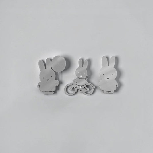 aelgmark Miffy silver metal magnets set: one holding a balloon, one on a bicycle, one standing.
