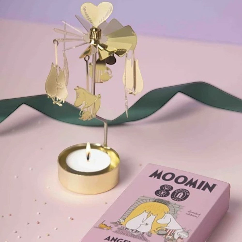 aelgmark Moomin 80th anniversary gold metal spinning tea light holder with Moomin characters. Includes candle.