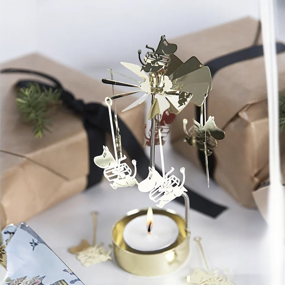 aelgmark Moomin gold metal rotating candle holder with Moomin figures holding gifts, includes candle.