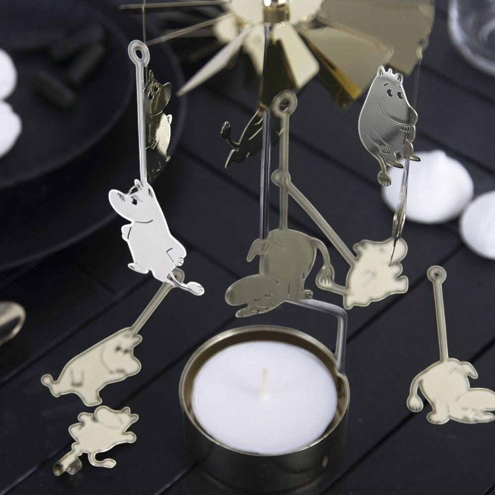 aelgmark Moomin gold metal spinning candle holder with white tea light and hanging Moomin characters.