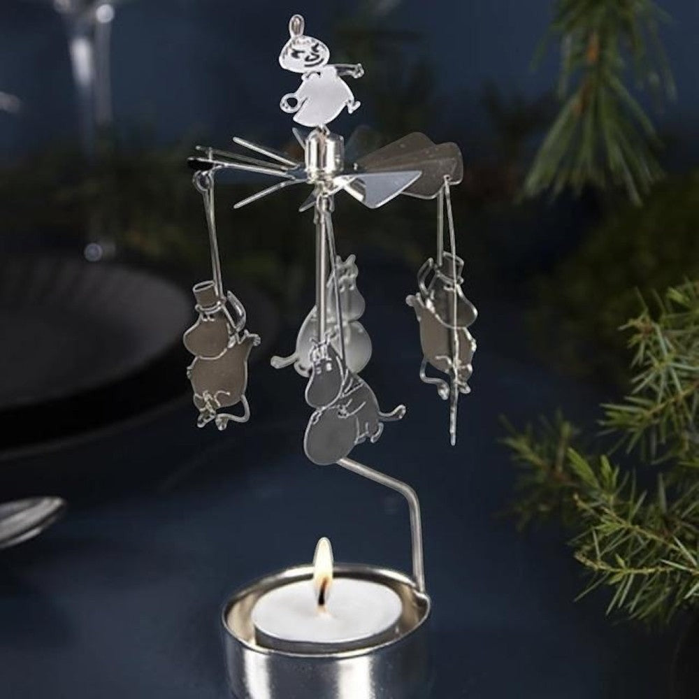 aelgmark Moomin winter spinning candle holder with metal figures and a lit tea light.