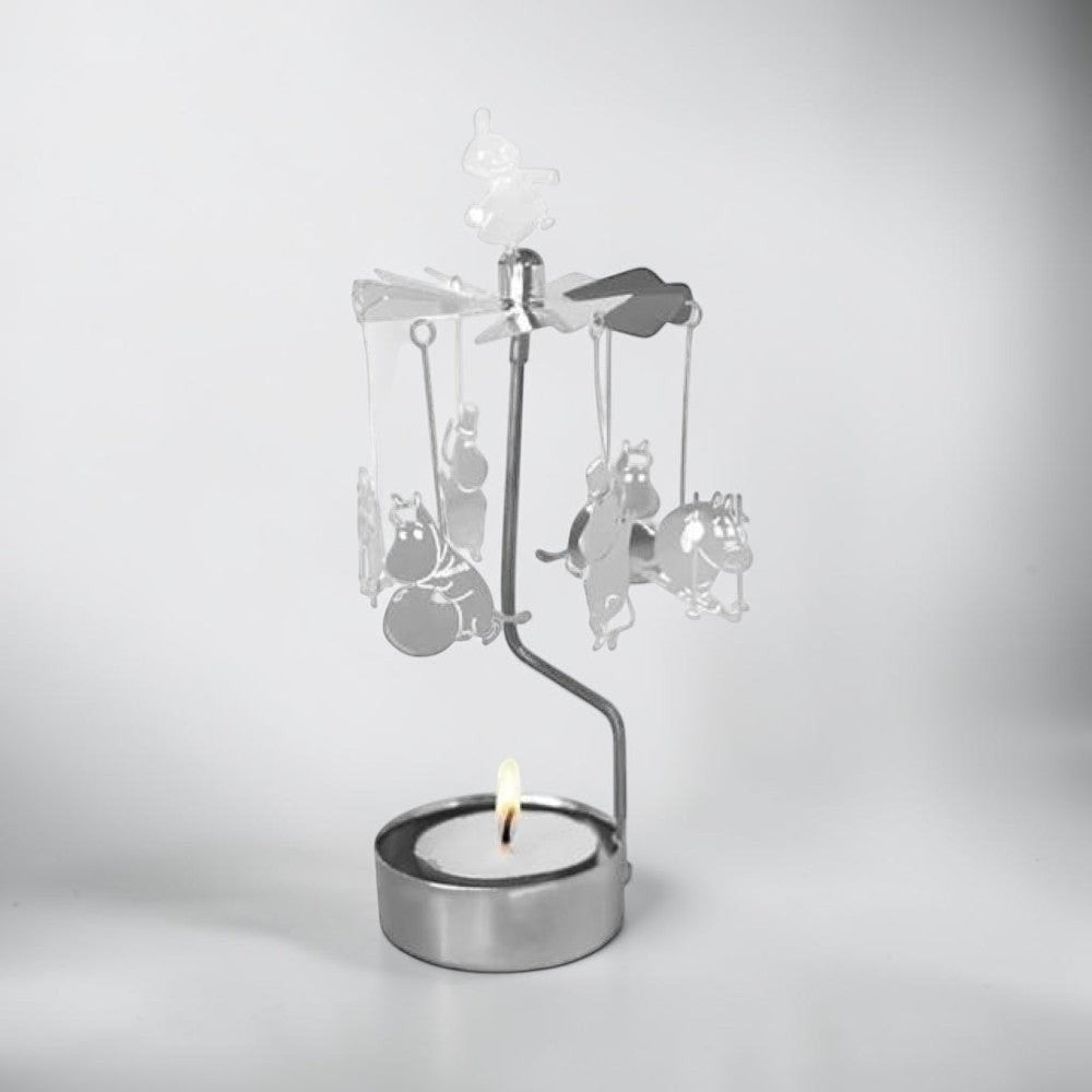 aelgmark Moomin metal spinning candle holder with Moomin characters and a lit tea light.