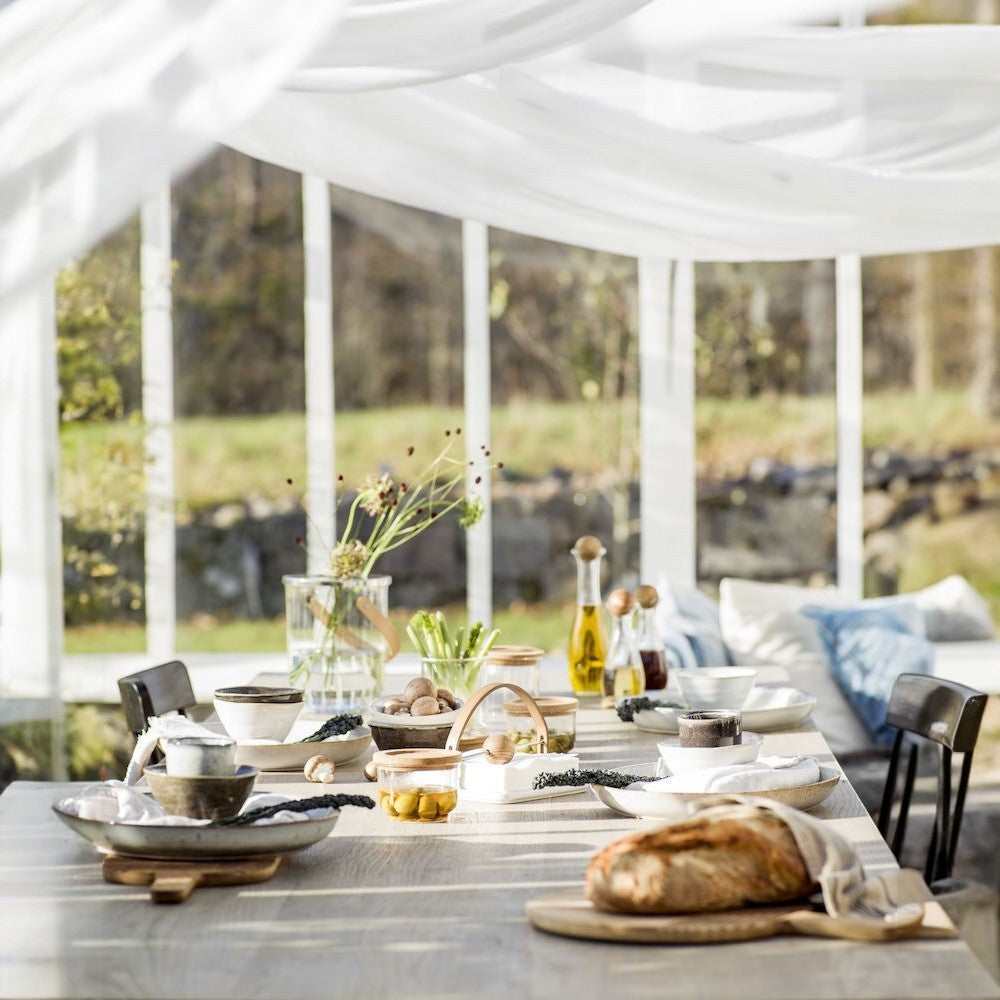 aelgmark Nature oak napkin holder with a stoneware base and oak ball, perfect for Nordic-style dining.