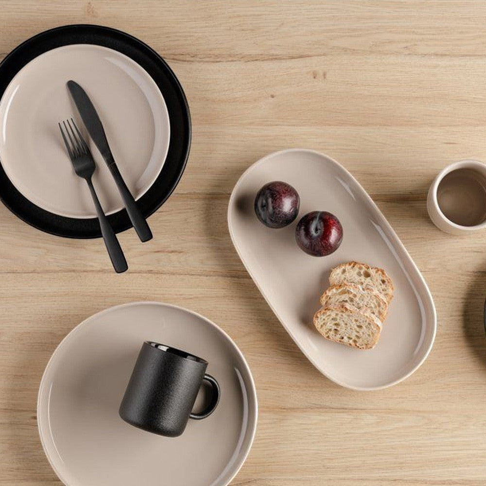 aelgmark oval ceramic serving platter in matte black and glossy beige, perfect for appetizers or desserts.