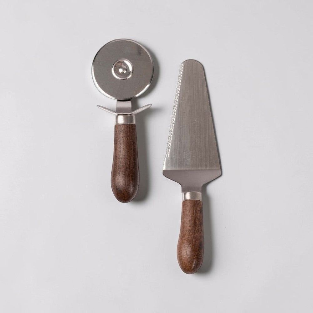 aelgmark Astrid stainless steel pizza cutter and server set with dark wood handles.