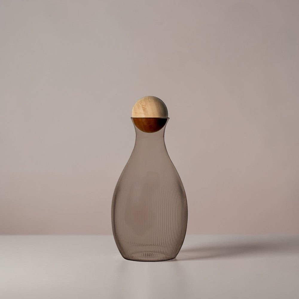 aelgmark water carafe with ribbed grey glass and a natural wood ball stopper. Nordic design.