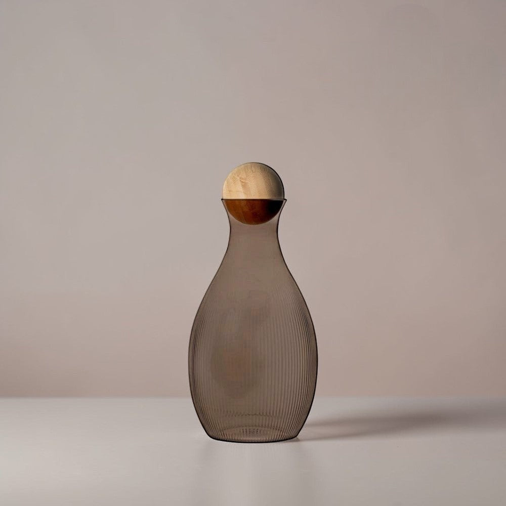 aelgmark water carafe with ribbed grey glass and a natural wood ball stopper. Nordic design.