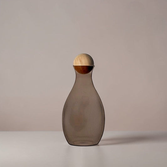 aelgmark water carafe with ribbed grey glass and a natural wood ball stopper. Nordic design.