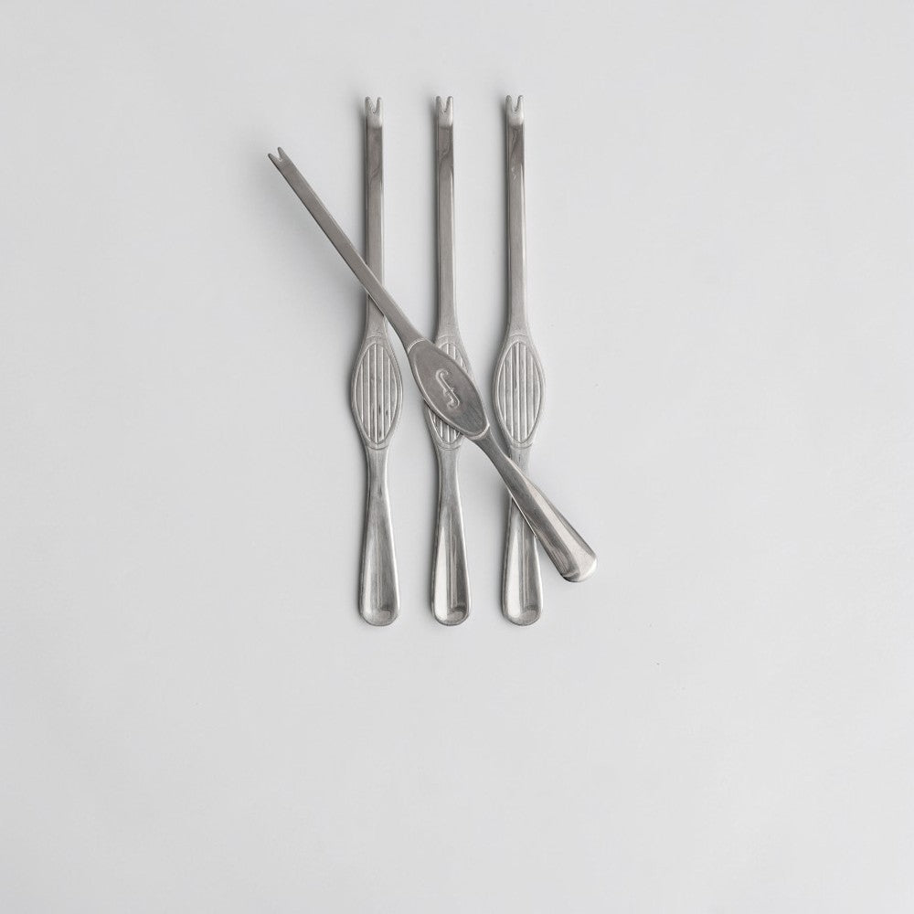 aelgmark Sivan 4-piece stainless steel seafood fork set with elegant ribbed handles and a subtle engraved initial.