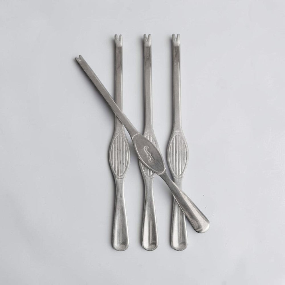 aelgmark Sivan 4-piece stainless steel seafood fork set with elegant ribbed handles and a subtle engraved initial.