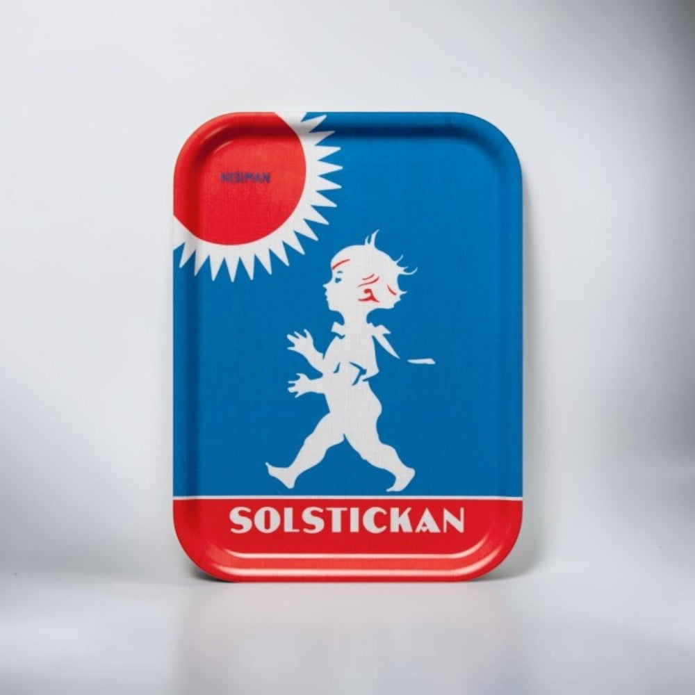 aelgmark Solstickan rectangular tray with blue background, white boy silhouette, and red sun detail. Features text 'SOLSTICKAN'.