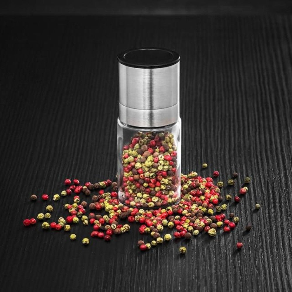Aelgmark stainless steel and glass spice grinder filled with peppercorns. Ideal for salt, pepper, or herbs.
