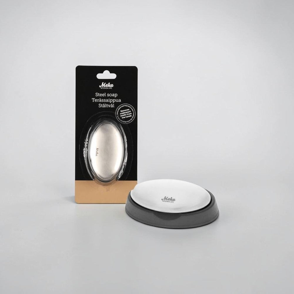 Aelgmark stainless steel soap bar with a grey base, designed to remove strong food odors from hands.
