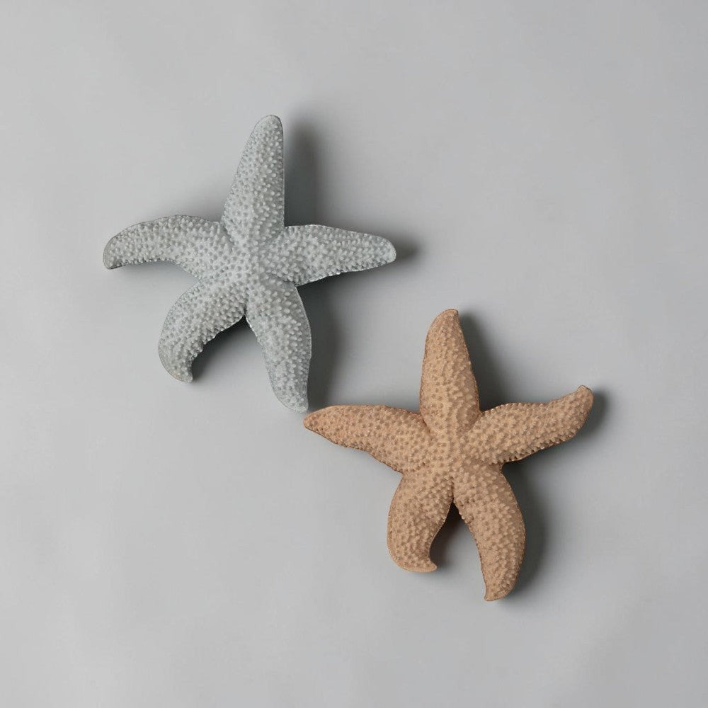 aelgmark ByOn two textured starfish wall decor, one in soft grey, the other in gentle apricot.
