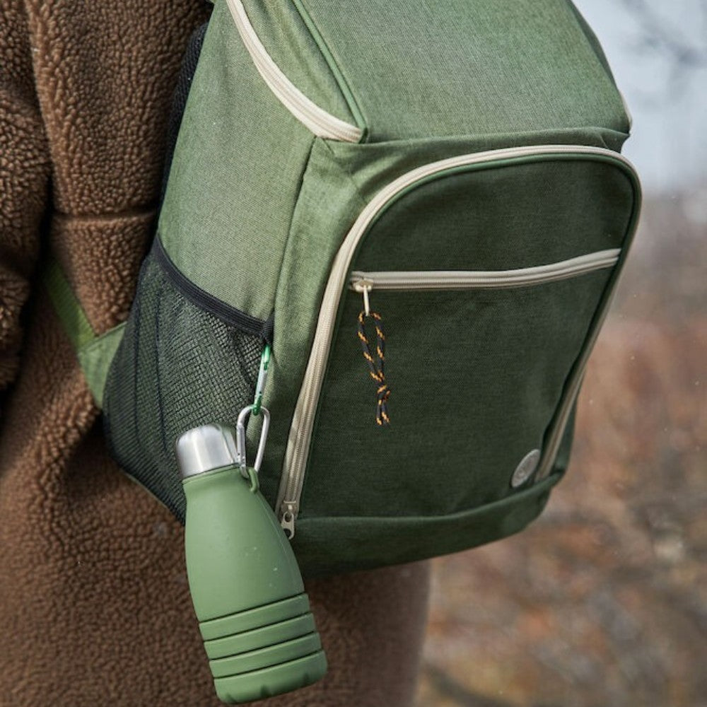 aelgmark Stig collapsible green silicone water bottle with stainless steel lid, attached to a backpack.