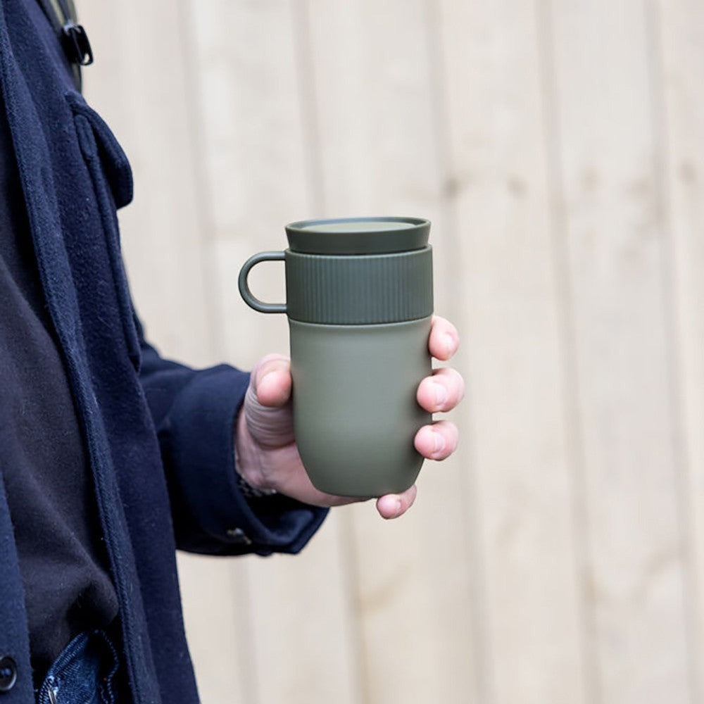 aelgmark Ted travel mug in olive green, made from recycled stainless steel with a ribbed grip and handle.