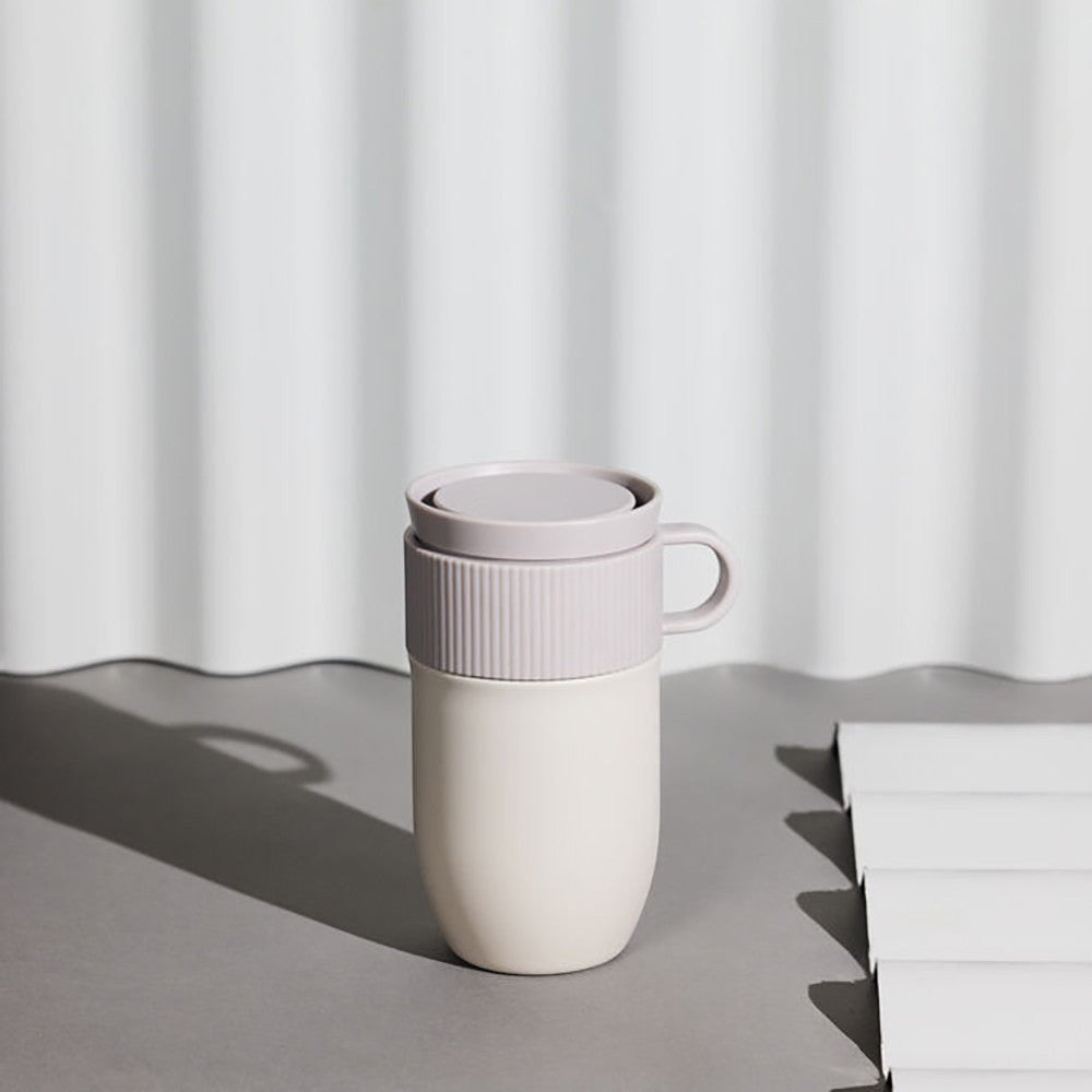 aelgmark Ted travel mug 280ml in cream and grey, made from recycled stainless steel with a 360-degree lid and handle.