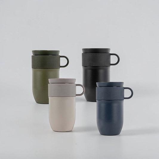 aelgmark Ted travel mug in olive green, black, beige, and navy. Stainless steel with ribbed lid and handle.
