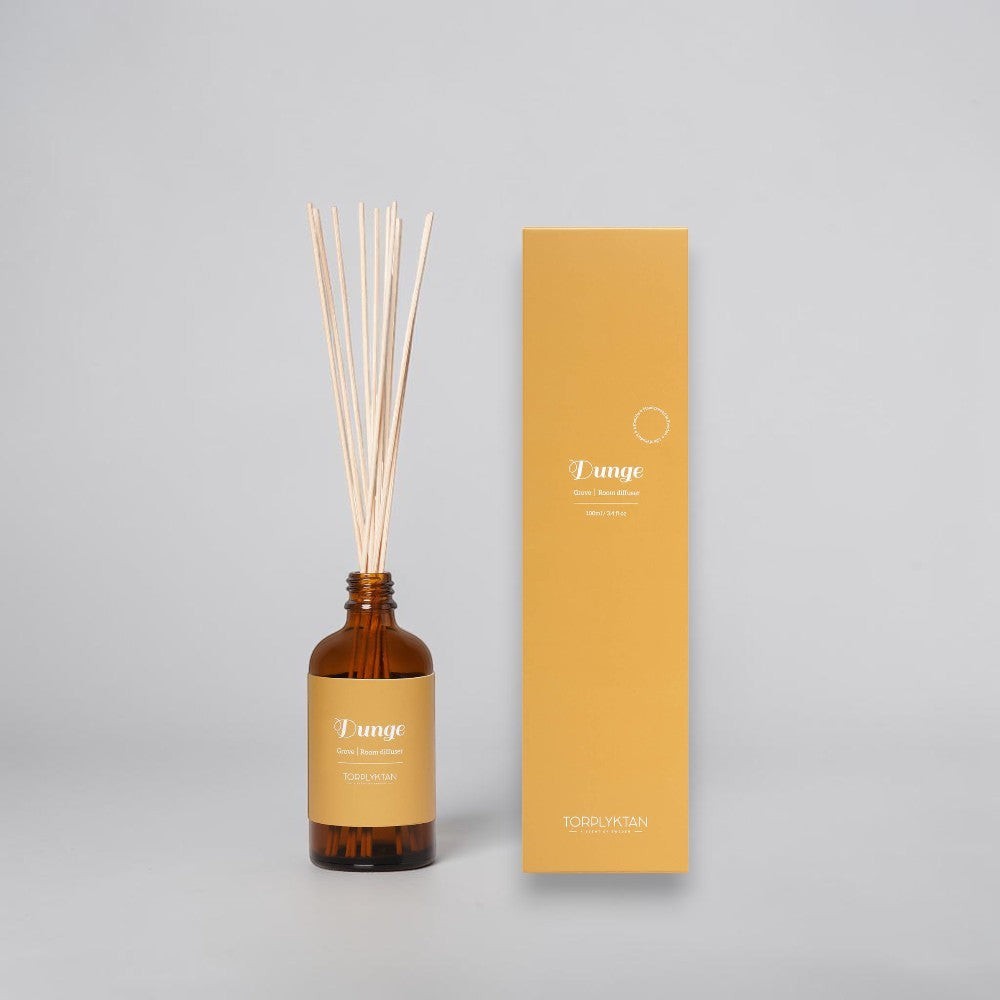 aelgmark Torplyktan amber glass reed diffuser with wooden reeds, Grove scent with violet, sage, and orchid notes.