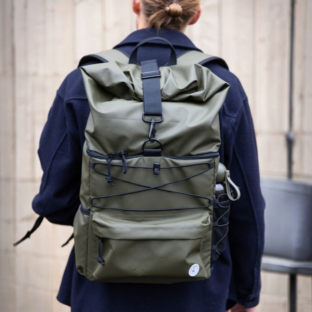 aelgmark Vide roll-top backpack in olive green, waterproof, 21L capacity, with bungee cords and side bottle holder.