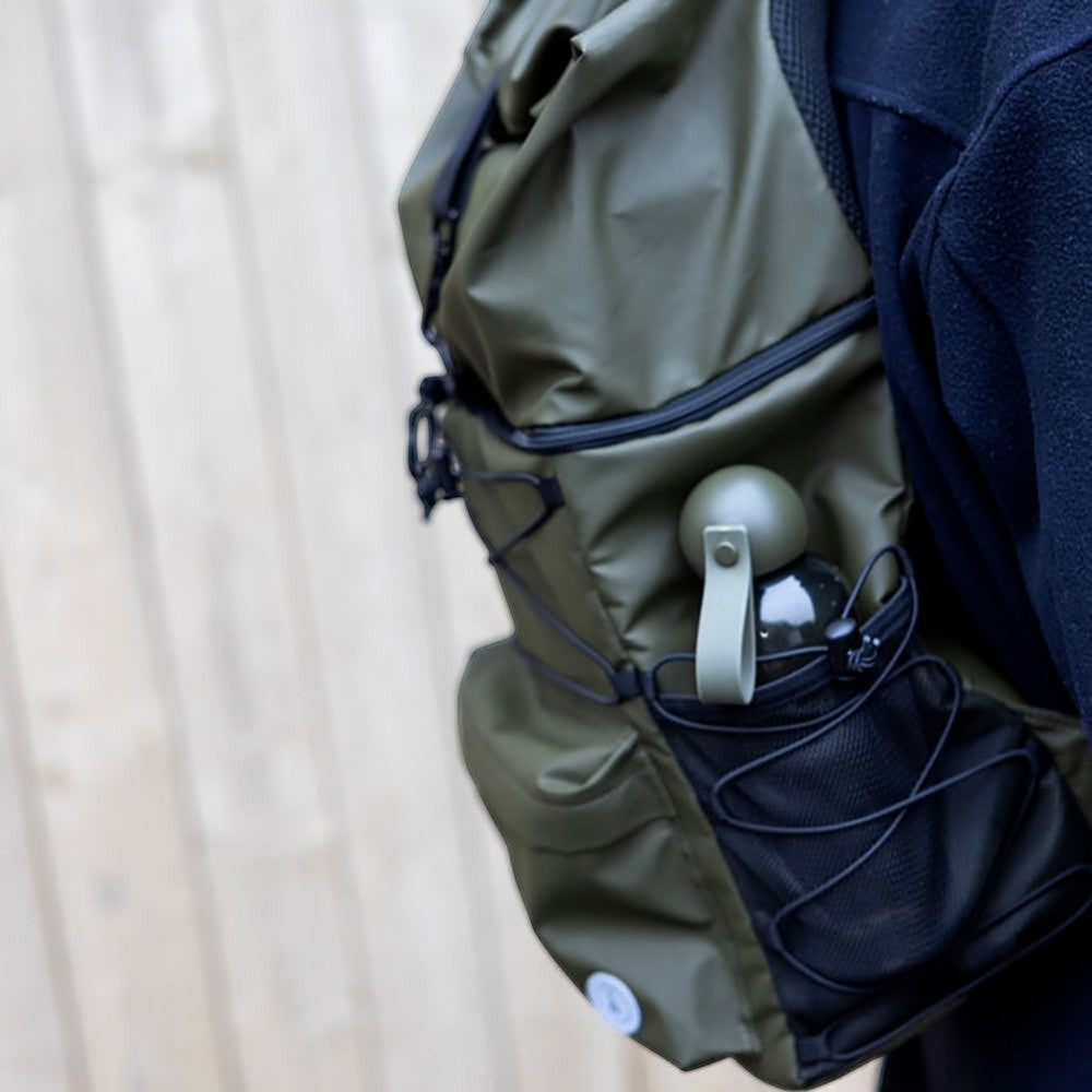 aelgmark Vide olive green waterproof backpack with side mesh pocket holding a water bottle.