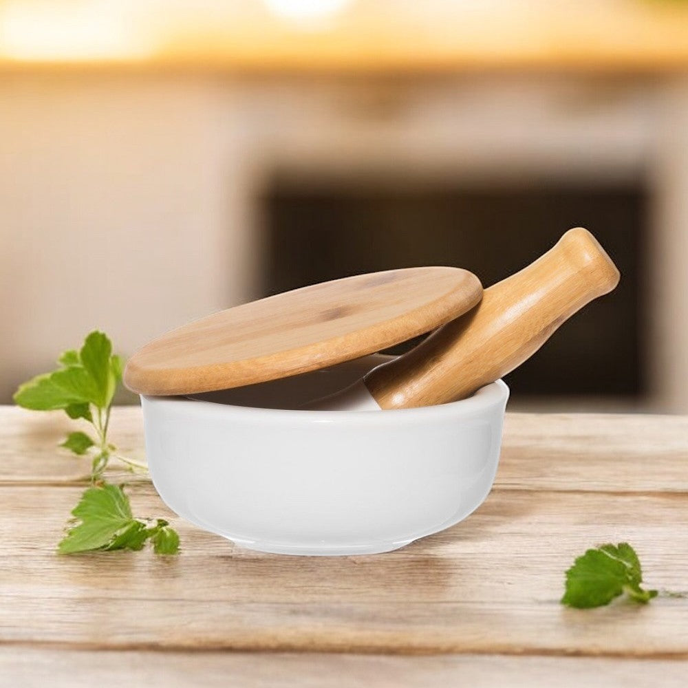 aelgmark mortar and pestle set with bamboo lid. White ceramic bowl for grinding herbs and spices.